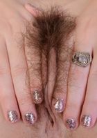 Cali tugging on her plush fur., Cali Hayes (cal022) ATK Natural & Hairy: Cali Hayes (Cali tugging on her plush fur.)